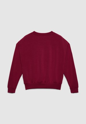 Felpa bordeaux con scollo rotondo, maniche lunghe, polsini a costine e orlo elasticizzato. Realizzata in tessuto morbido e strutturato. Nessun motivo visibile.
