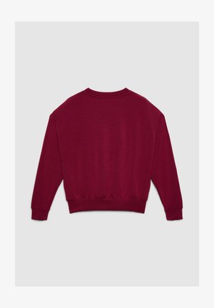 Felpa bordeaux con scollo rotondo, maniche lunghe, polsini a costine e orlo elasticizzato. Realizzata in tessuto morbido e strutturato. Nessun motivo visibile.