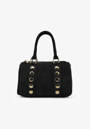 Sac à main noir avec deux poignées, clous ronds dorés disposés en deux rangées verticales, et fermeture à glissière sur le dessus, sur fond blanc.