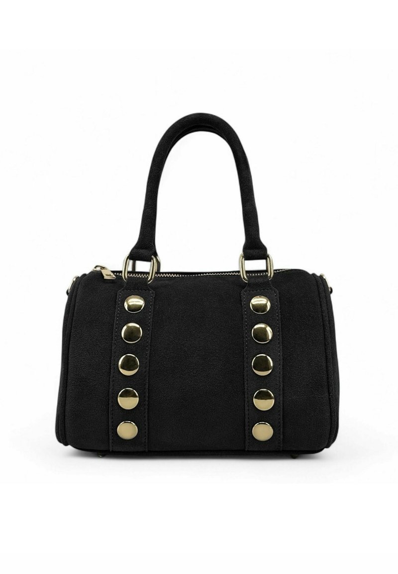 Sac à main noir avec deux poignées, clous ronds dorés disposés en deux rangées verticales, et fermeture à glissière sur le dessus, sur fond blanc.