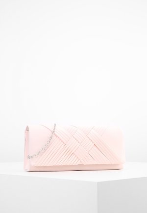 Pale pink clutch bag with textured diagonal strap design and a silver chain handle, placed on a white pedestal against a white background.