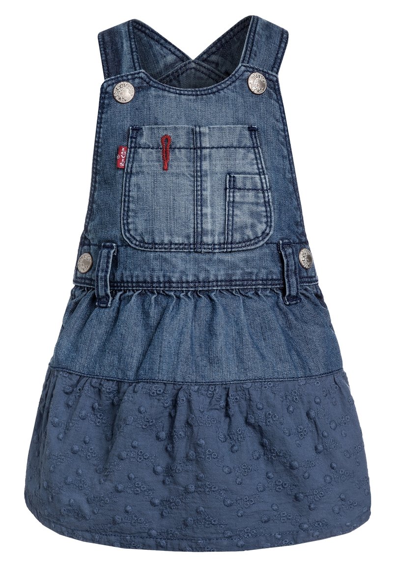 Sukienka ogrodniczka z dżinsu z regulowanymi krzyżującymi się ramiączkami, z przednią kieszenią, rozkloszowanym dołem i teksturowanym niebieskim materiałem z haftowanymi kropkami.