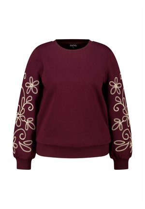 Sweatshirt bordeaux à manches longues, avec des broderies florales blanches sur les manches. Encolure ronde et poignets et ourlet côtelés. Texture de tissu douce.