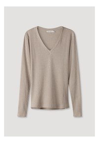 Beige långärmad tröja med V-hals och ribbad textur. Volangen är rak och ärmarna är något åtsittande vid manschetterna.