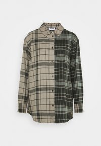 Chemise à carreaux avec un mélange de couleurs beige, vert et noir. Fabriquée en tissu doux, avec des manches longues et un col classique.