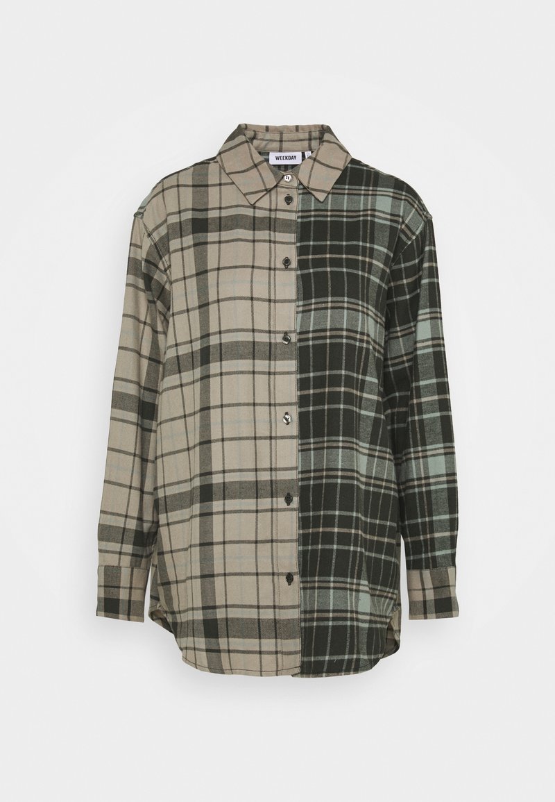 Chemise à carreaux avec un mélange de couleurs beige, vert et noir. Fabriquée en tissu doux, avec des manches longues et un col classique.