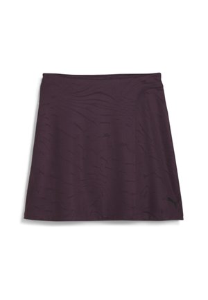 Gonna sportiva viola con un motivo testurizzato, fascia elastica in vita e un piccolo logo nero. Tessuto leggero adatto per attività sportive.