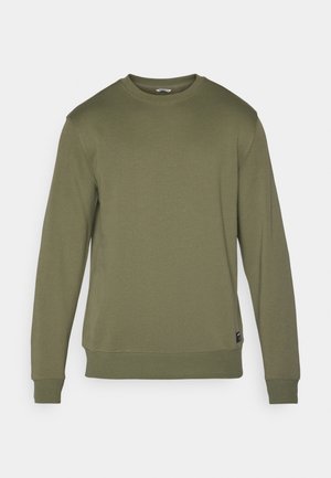 Olivgrön sweatshirt med rund halsringning, långa ärmar och ribbade muddar. Mjuk tyg med en enfärgad struktur och subtila sömnadsdetaljer.