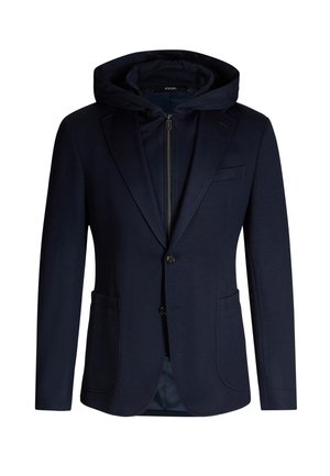 Marineblauer Blazer mit abnehmbarem Kapuzen, zwei Fronttaschen, Ein-Knopf-Verschluss und dezenter Textur. Innenfutter aus passend abgestimmtem Stoff.