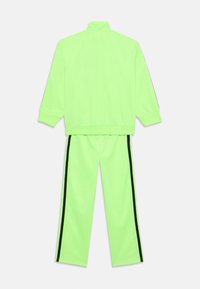 adidas Originals FIREBIRD UNISEX  - Tréningruha alsók - signal green