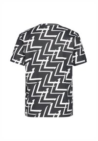 Kortärmad t-shirt i svart och vitt, med ett geometriskt zickzackmönster. Tillverkad av ett mjukt, lätt tyg.