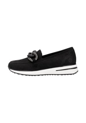 Mocassins en daim noir avec un détail de nœud décoratif, semelle blanche et accents texturés, présentant un bout arrondi et une silhouette épurée.