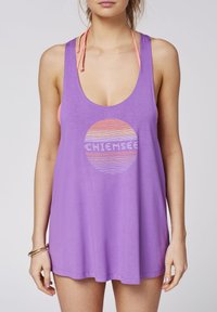 Purple tank top made of lightweight fabric, featuring a low scoop neckline, a graphic sun design in orange and white, and thin straps.