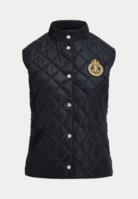 Marinblå quiltad väst med hög krage, silverknappar med tryckknapp och en broderad logotyp med en krona och lagerblad på vänster sida.