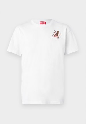 White cotton t-shirt with short sleeves. Features a small embroidered spider design on the left chest and a red logo label.