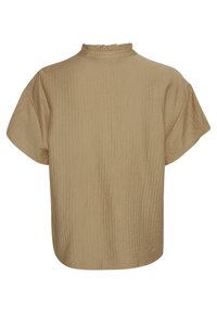 Top beige a maniche corte con colletto arricciato e texture stropicciata. La parte posteriore presenta una vestibilità morbida, orlo arrotondato e tessuto soffice.