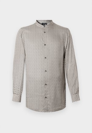 Long-sleeve shirt in a beige and black geometric pattern, featuring a stand-up collar and button front, made from a lightweight fabric.