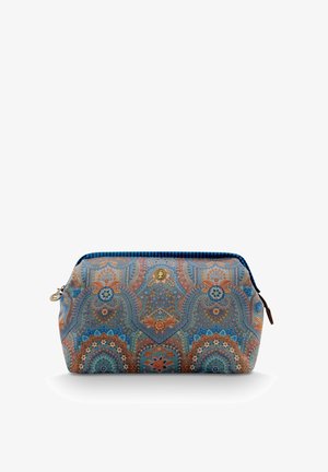 Cosmetic bag with a rounded shape, featuring a blue and orange paisley pattern, a metallic zipper, and a gold logo accent. Fabric texture.