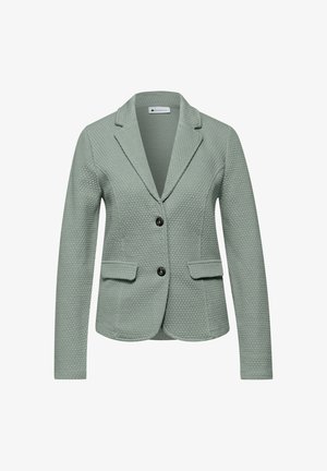 Lichtgroene gebreide blazer met een reverskraag, twee voorzakken en twee zwarte knopen. Gemaakt van geweven stof, met een aansluitend ontwerp.