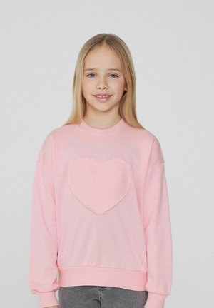 Rosa Baumwoll-Sweatshirt mit einer strukturierten Herzapplikation in der Mitte, lockere Passform, langenÄrmeln und gerippten Bündchen.