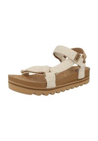 Light beige woven sandals with adjustable straps, cork footbed, and a textured rubber outsole featuring a zigzag pattern for grip.
