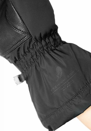 Black down jacket sleeve with a textured leather accent, elasticized cuff, and a label reading “Premium Down Natural Warmth.”