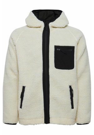 Crème fleece jack met een zwarte rits aan de voorkant, een zwarte borstzak en zwarte zijzakken; heeft een capuchon en geribde manchetten.