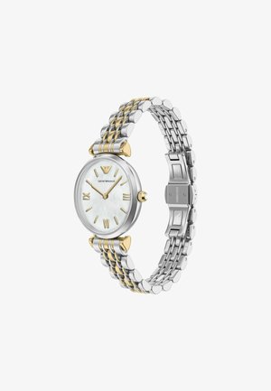 Round silver and gold wristwatch with white face, gold Roman numerals, and two-tone metal link bracelet, displaying 10:08.