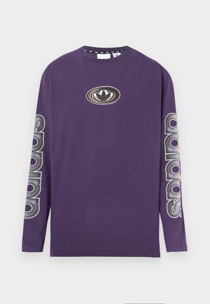 Fioletowa bawełniana koszula z długim rękawem. Posiada okrągły dekolt, centralne logo oraz pionowy napis na obu rękawach. Gładka faktura.