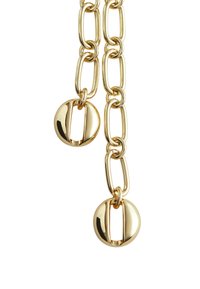 Goldene Kettenhalskette mit großen ovalen Gliedern und kreisförmigen Akzenten mit Ausschnitten, die ein poliertes Finish und eine reflektierende Oberfläche aufweist.