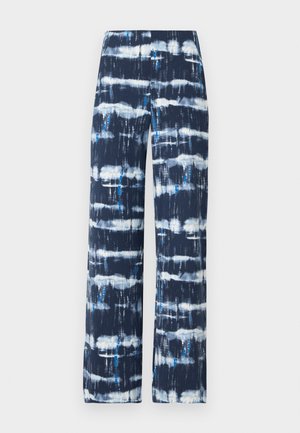 Breda byxor i marinblått med mönster i vit och turkos tie-dye. Tillverkade av lättviktsmaterial, med en mjuk textur och avslappnad passform.