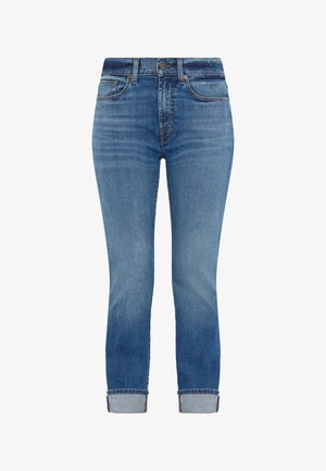 Højtaljede blå jeans lavet af denim, med en lys vask, smalle ben og opkrøllede sider for et cropped look.