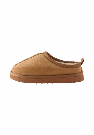 Beige Wildlederschlapfen mit einem weichen, flauschigen Innenfutter, abgerundeter Spitze und einer flexiblen Gummisohle mit strukturierter Oberfläche. Einfaches Anzieh-Design mit einer hinten angebrachten Lasche.