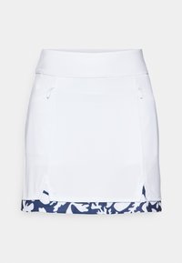 White athletic skirt with a smooth texture, featuring zippered side pockets and a navy blue floral pattern at the hem.