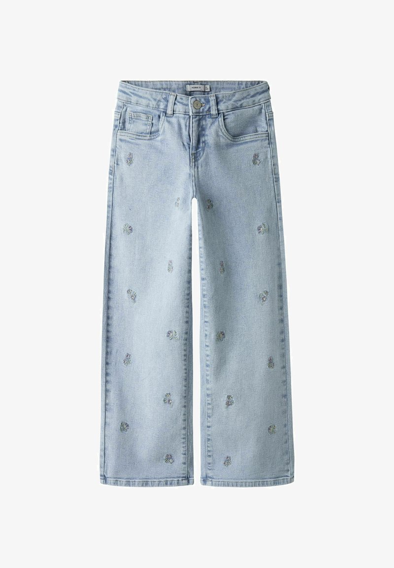 Helesinised laiade säärtega teksad, valmistatud denimist ja kaunistatud väikeste lilletikanditega. Klassikaline viiepulga disain ja nööbitav sulgemine koos sirge servaga.