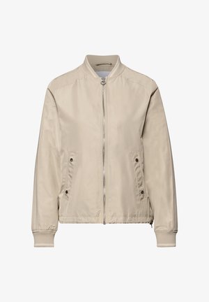 Vaaleanbeige bomber-takki, jossa on edessä vetoketju, kaksi painonappitaskua sekä resorit kauluksessa, hihansuissa ja helmassa.