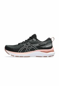 Black athletic shoe with a textured knit upper, white accents, cushioned pink midsole, and black laces. Features a tab at the heel.