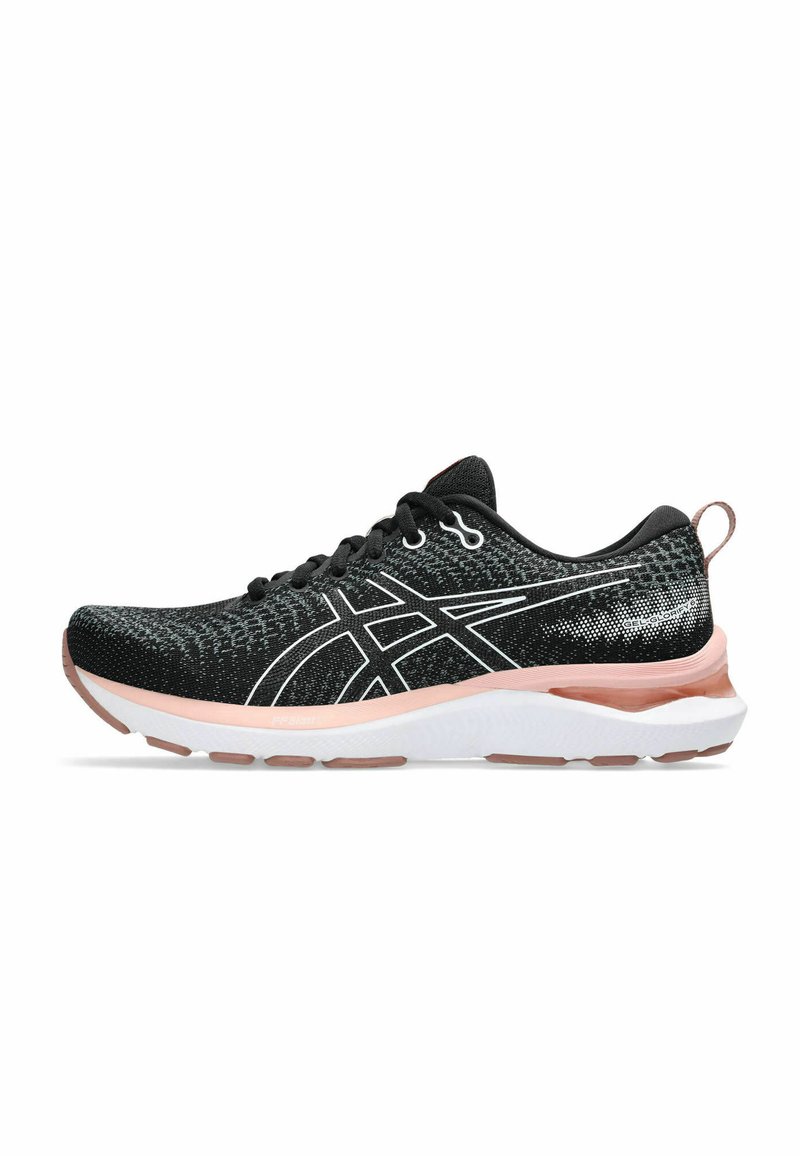 Black athletic shoe with a textured knit upper, white accents, cushioned pink midsole, and black laces. Features a tab at the heel.