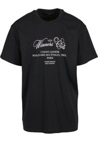 Black cotton T-shirt featuring white text: "Winners Club," "Casino Lumière," and "Where dreams meet destiny." Short sleeves and round neckline.