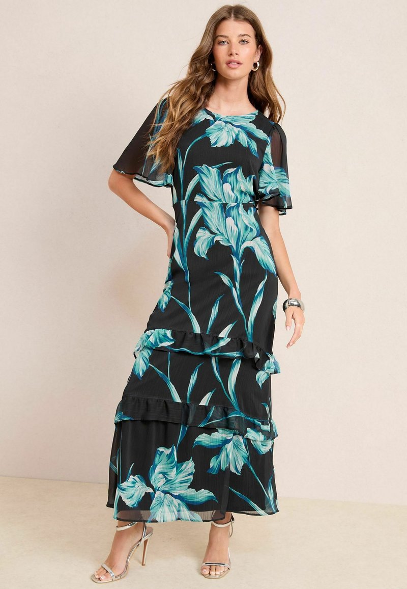 Schwarzes Blumenkleid mit türkisfarbenen Blumenmustern, Rüschenschichten und kurzen Ärmeln. Aus leichtem Stoff, mit Rundhalsausschnitt.