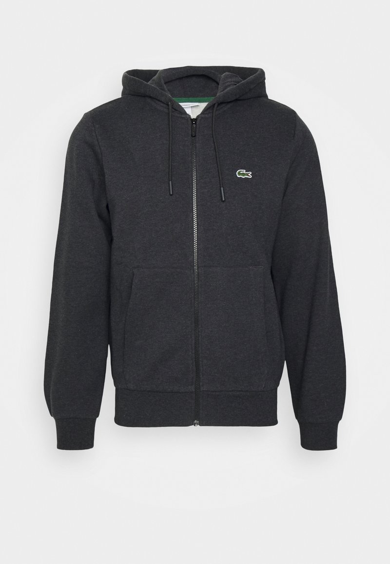 Sweat à capuche zippé intégral gris foncé avec capuche à cordon, poches avant, poignets côtelés et petit logo crocodile vert sur la poitrine gauche.