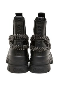 Black ankle boots with a chunky sole, featuring a distinctive chain detail across the back and branded straps on the sides.