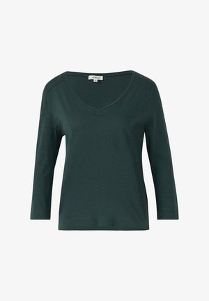 Tamsiai žalia ilgomis rankovėmis palaidinė su V formos iškirpte ir šiek tiek laisva siluetu. Pagaminta iš minkštos, lengvos medžiagos su glotnia tekstūra.