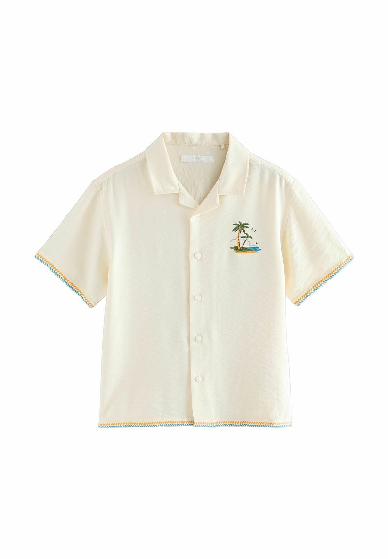 Chemise à manches courtes crème avec un design brodé représentant un palmier et une île. Dotée d'une fermeture à boutonné à l'avant et d'accents colorés sur les manches.