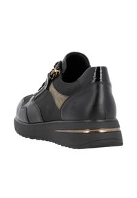 Black sneaker featuring a textured leather and fabric upper, gold-tone zipper detail, and a contrasting black sole with a metallic accent.