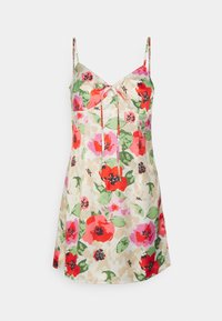 Robe florale avec un mélange de fleurs rouges, roses et vertes sur un fond beige, dotée de fines bretelles et d'un détail noué à l'avant.
