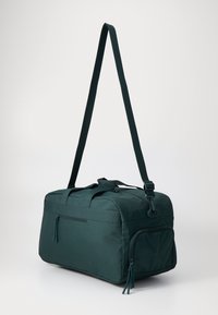 Lacoste ROLL BAG UNISEX - Ranac - sinople