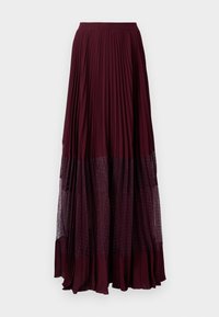 Gonna maxi plissettata bordeaux con fondo trasparente a pois. La trama del tessuto è liscia, con una vita elasticizzata per il massimo comfort.