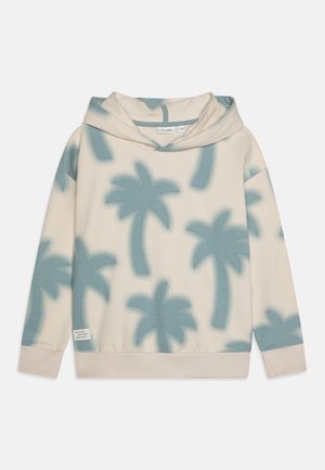 Kapturowa bluza w kolorze kremowym z jasnoniebieskim wzorem palm. Posiada beżowe ściągacze u dołu i na rękawach, wykonana jest z miękkiego, teksturowanego materiału.