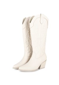 Botas de vaquero de cuero blanco con intrincado bordado, punta afilada y tacón cuadrado, que cuentan con un detalle de costura superior decorativa.